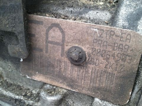 1994 Ford Bronco - Close-up of a transmission identification tag showing various part numbers and codes.