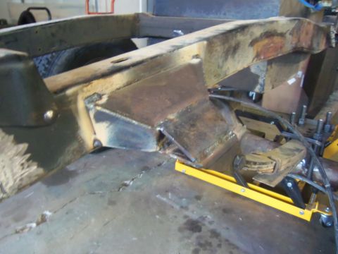 1968 Ford Bronco - Modified vehicle frame section undergoing repair or modification.