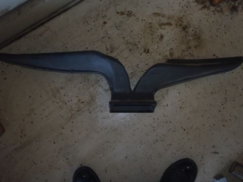 1978 Ford Bronco - A black plastic air intake duct is shown from above, resting on a concrete surface.
