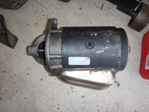 1978 Ford Bronco - A starter motor is shown on a concrete surface, with a SuperMotors.net watermark visible.