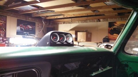 1967 Ford F-250 - Dashboard view of a green truck with a triple gauge pod installed.