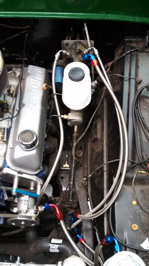 1967 Ford F-250 - Engine bay details including brake master cylinder and braided fuel lines. A 'Power Ford' valve cover is visible.