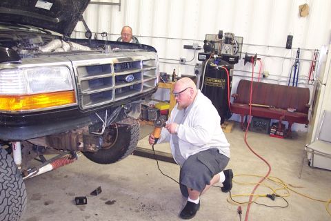 1996 Ford Bronco - This is me grinding the frame after Keith cut off the bumper brackets with the plasma