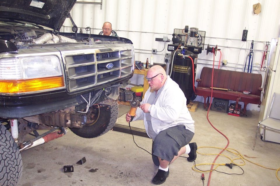 This is me grinding the frame after Keith cut off the bumper brackets with the plasma
