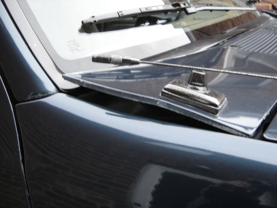 Dark blue 1996 Ford Bronco hood ornament and windshield wiper