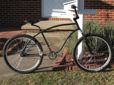 1994 Ford Bronco - Custom cruiser bicycle with a unique frame design and knobby tires is shown outdoors.
