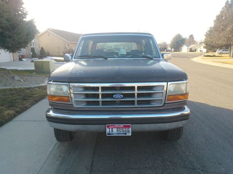1992 Ford Bronco - Front view of a 1992 Ford Bronco parked on a residential street.