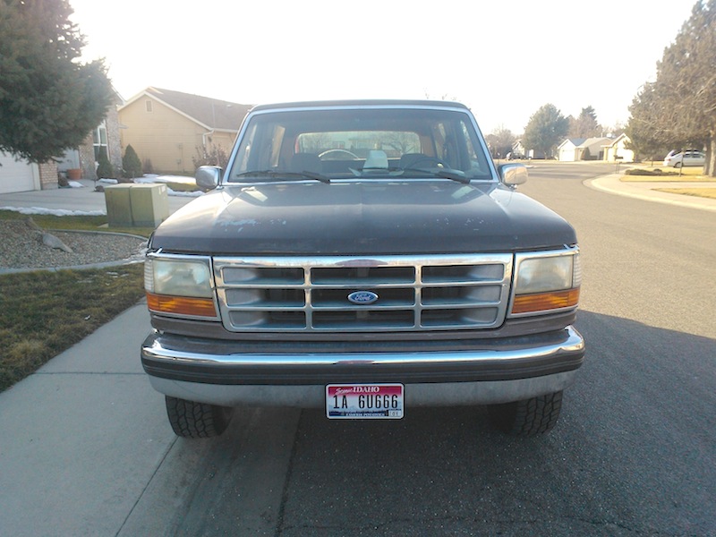 1992 Ford Bronco front view with chrome grille and license plate 1A 6UG66