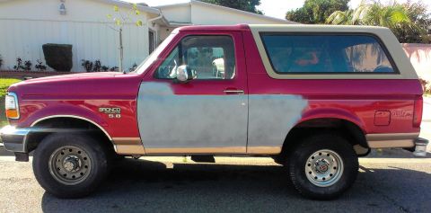1994 Ford Bronco - This 1994 Ford Bronco is undergoing bodywork, with primer visible on the doors.
