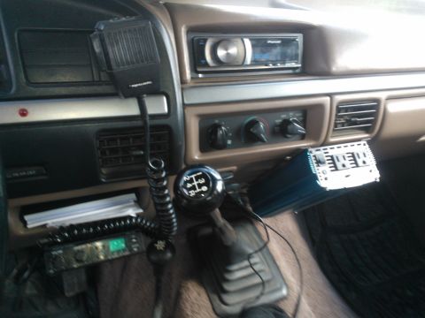 1992 Ford Bronco - This vehicle's interior features a Realistic CB radio, Pioneer stereo, and an aftermarket amplifier, suggesting custom upgrades.
