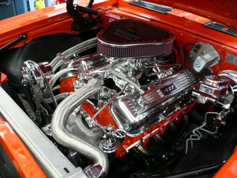 1968 Chevrolet Camaro - Engine bay features a polished 427 V8 engine with orange accents and chrome components.