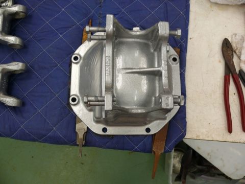 1976 Chevrolet Corvette - A silver differential cover is bolted down on a blue mat, with tools nearby.