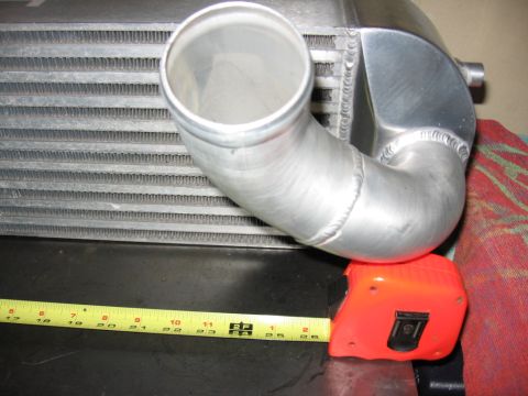 1995 Ford Bronco - Intercooler pipe and radiator fins shown with a measuring tape for scale.