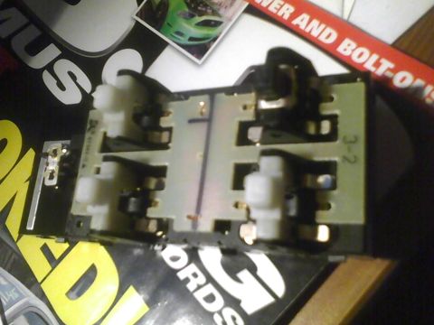 2003 Ford Crown Victoria - An electrical component with multiple connectors is shown, with text and a small image visible in the background.
