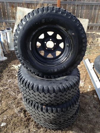 1992 Ford Bronco - Stack of off-road tires with black rims, some text visible on the sidewall.