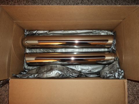 2004 Mercury Grand Marquis - A pair of new chrome exhaust tips are shown packed inside a shipping box.