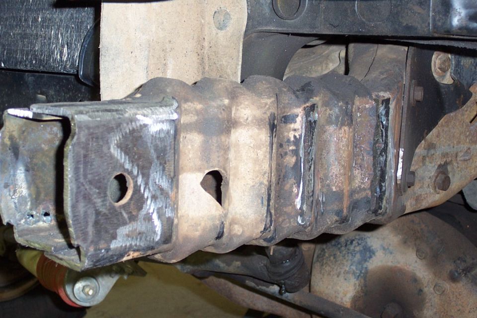 Underside of vehicle frame with welded and reinforced boxed steel member