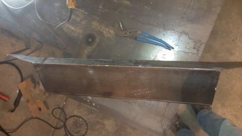 1995 Ford Bronco - Metal fabrication project in progress with welding equipment and tools nearby.