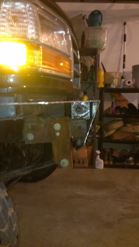1995 Ford Bronco - Front view of a 1995 Ford Bronco, showing the bumper and headlight.