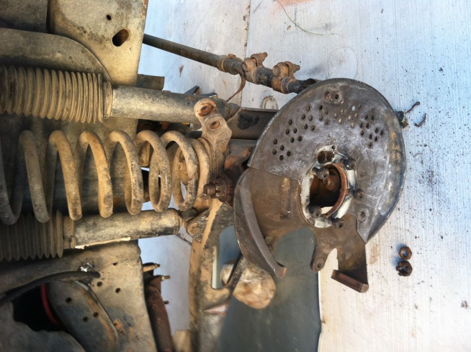 close-up of vehicle suspension component and brake rotor