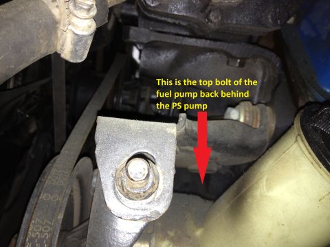 1978 Ford Bronco - This image shows a close-up of an engine component, specifically highlighting the top bolt of the fuel pump located behind the power steeri…