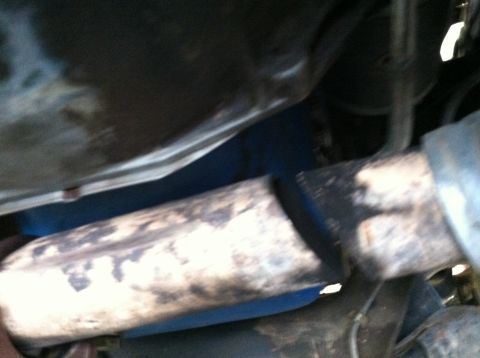 1989 Ford Bronco - The PO had wrapped sheet metal to the exhaust to stop the leak. Held it on there with some exhaust clamps.