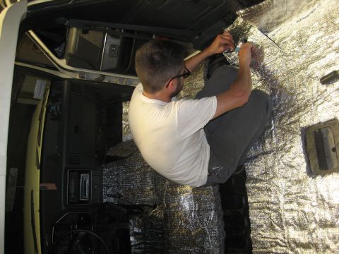1989 Ford Bronco - Soundproofing material is being installed inside the interior of a 1989 Ford Bronco.