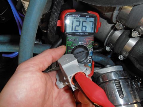 1990 Ford Bronco - Testing resistance of a vehicle sensor using a multimeter, which displays 126.7 ohms.