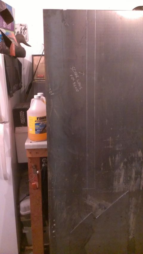 1995 Ford Bronco - A metal sheet is marked for bending, with a jug of orange liquid nearby.