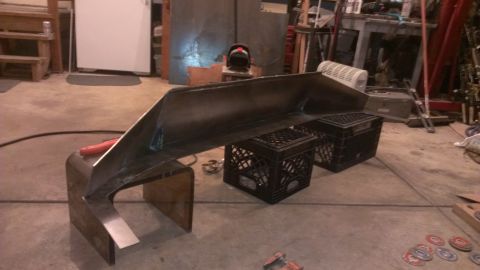 1995 Ford Bronco - A custom metal bumper part is shown in a workshop setting.