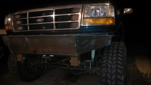 1995 Ford Bronco - A custom metal bumper is fitted to the front of this 1995 Ford Bronco, which also features large off-road tires.