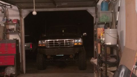 1995 Ford Bronco - Front view of a 1995 Ford Bronco parked inside a garage.