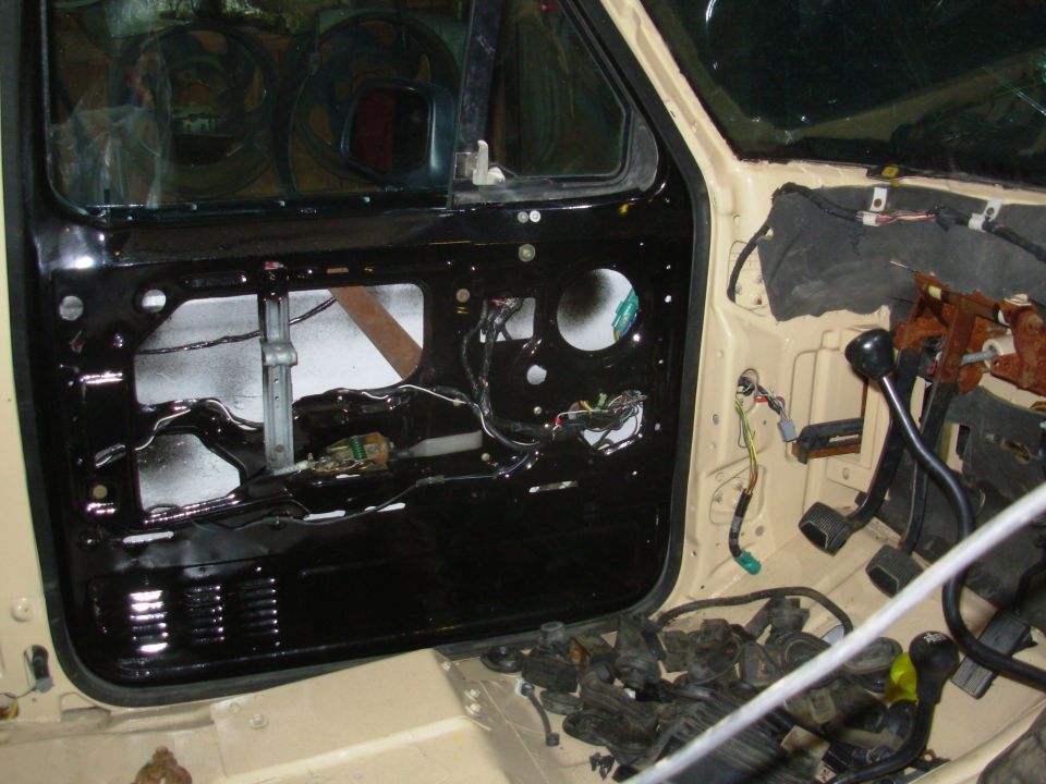 Other than the speaker & door panel, this door is finished.  The harness is routed along the bottom of the w/s thru the white clips that also support the firewall insualtion.

ERROR: the white plastic hooks are installed upside-down in this pic. I had to remove them all & install them correctly before the dash would fit.