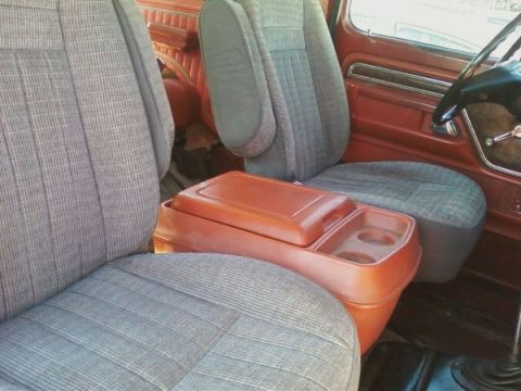 1978 Ford Bronco - Interior view of a vehicle's front seats and center console.