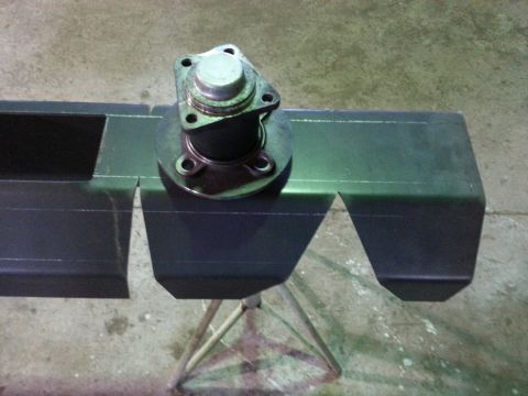 1994 Ford Bronco - Automotive part with flange mounted on a metal structure, possibly for a vehicle repair or modification.