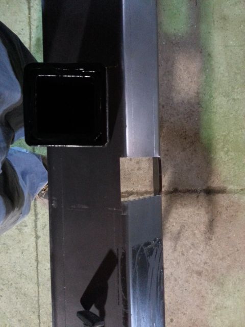 1994 Ford Bronco - A close-up view of a trailer hitch receiver, showing its construction and attachment point.