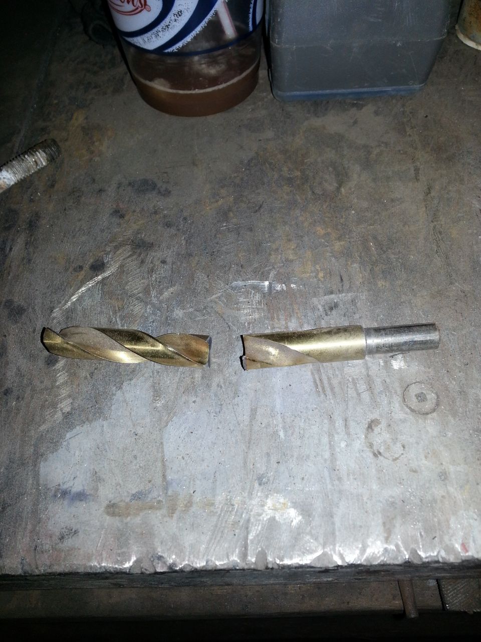 Broken drill bit on a workbench