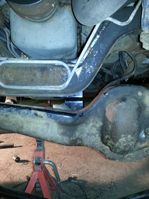 1994 Ford Bronco - The underside of a vehicle is shown, focusing on suspension components and exhaust system parts.