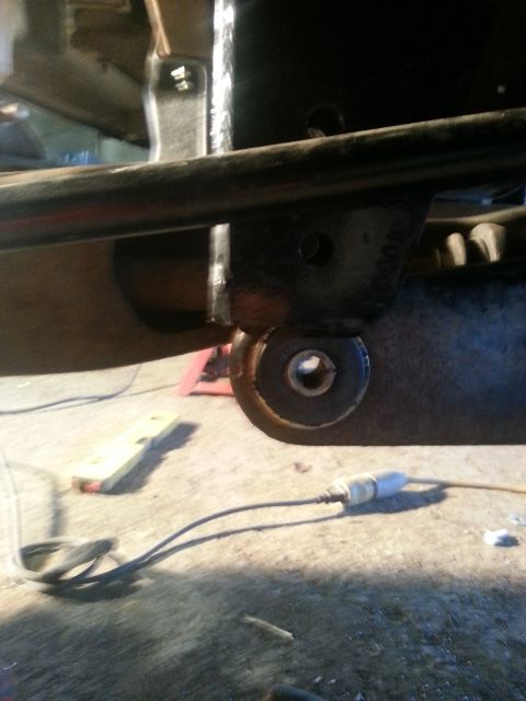 1994 Ford Bronco - Undercarriage view of a vehicle's suspension component, possibly during maintenance or repair.