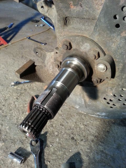 1994 Ford Bronco - Close-up of a splined axle shaft, likely undergoing maintenance or repair.