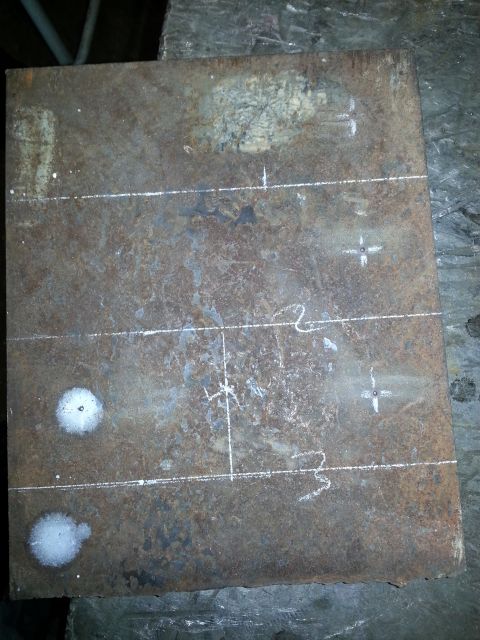 1994 Ford Bronco - Metal plate marked with scribe lines and drill points, likely for fabrication or repair.