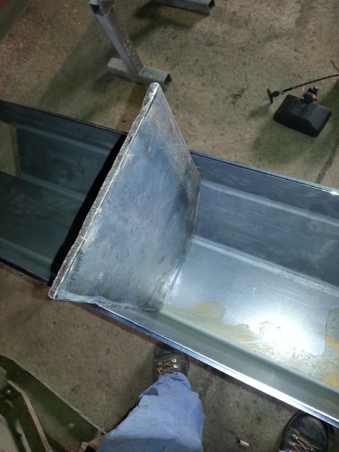 1994 Ford Bronco - A metal channel with a welded internal plate is shown from a high angle.