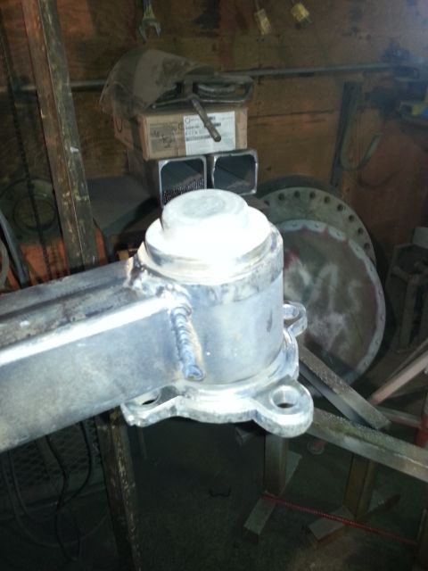 1994 Ford Bronco - Workshop scene shows a welded metal part with a white cap, possibly for a vehicle's suspension system.