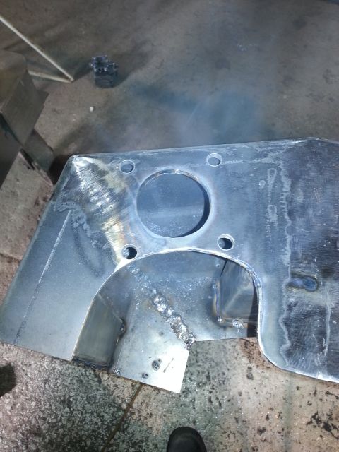 1994 Ford Bronco - Close-up of a fabricated metal component with visible welding and machining.
