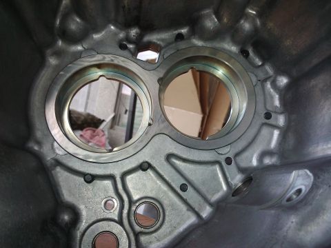 1995 Ford Probe - This is a close-up view of a metal engine component, showing its internal structure and openings.