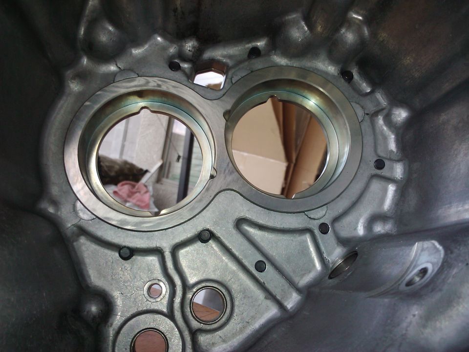 Close-up of an engine's internal casting with two circular openings