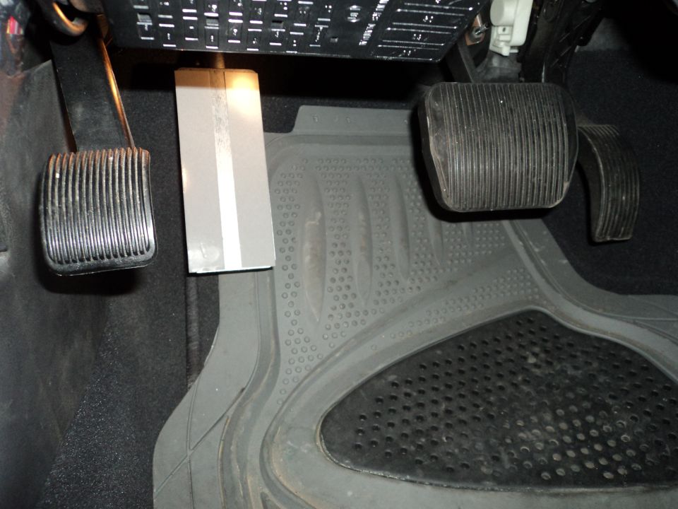 2004 Mercury Grand Marquis interior footwell with brake, accelerator, and dead pedals, and a fuse box
