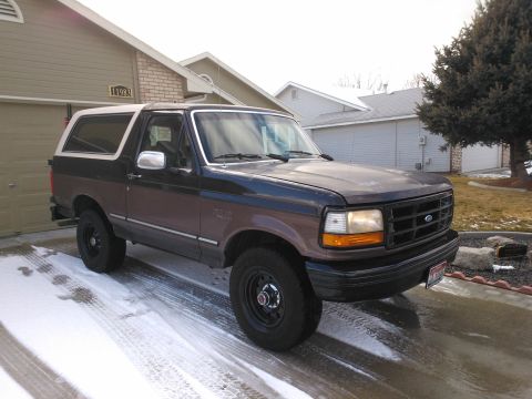 1992 Ford Bronco - 1992 Ford Bronco in a driveway with snow on the ground.
