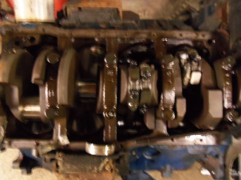 1989 Ford Bronco - Close-up view of an engine's internal components, showing the crankshaft and connecting rods.