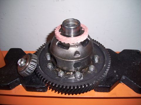 1995 Ford Probe - Close-up of a vehicle differential part with a bearing and gear, mounted in a vise.